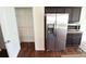 Modern kitchen showcasing stainless steel refrigerator, dark cabinets, and pantry at 3014 Green Apple Dr, Dallas, NC 28034