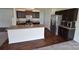Well-equipped kitchen featuring dark cabinets, stainless steel appliances, and a kitchen island at 3014 Green Apple Dr, Dallas, NC 28034
