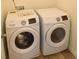 Modern laundry room with stainless steel washer and dryer at 3014 Green Apple Dr, Dallas, NC 28034