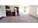 Open-concept kitchen and living room area perfect for entertaining and relaxing at 3014 Green Apple Dr, Dallas, NC 28034