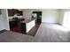 Open-concept kitchen and living room area perfect for entertaining and relaxing at 3014 Green Apple Dr, Dallas, NC 28034