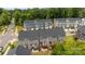 Aerial view showcasing townhomes with decks and patios and lawns at 3108 Beeler Ln, Charlotte, NC 28208