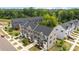 Aerial view of townhomes with trees and green space, providing a serene and picturesque setting at 3108 Beeler Ln, Charlotte, NC 28208