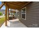 View of patio, yard, and deck above with access to the home at 3108 Beeler Ln, Charlotte, NC 28208