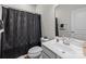 Full bathroom featuring a shower with dark curtain and single sink at 3108 Beeler Ln, Charlotte, NC 28208