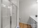 Bathroom featuring a glass enclosed shower and single sink vanity at 3108 Beeler Ln, Charlotte, NC 28208