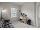 Bright room featuring a futon, desk, and window with natural light at 3108 Beeler Ln, Charlotte, NC 28208