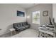 Well-lit room featuring a futon, desk, and window with natural light at 3108 Beeler Ln, Charlotte, NC 28208