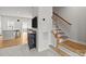 Hallway with wood stairs, a view of the kitchen, and modern decor at 3108 Beeler Ln, Charlotte, NC 28208