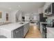 Kitchen view showcasing stainless steel appliances, a breakfast bar, and an open concept layout at 3108 Beeler Ln, Charlotte, NC 28208