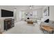 Living room with a white sofa, wood coffee table, and well lit with natural light at 3108 Beeler Ln, Charlotte, NC 28208