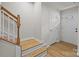 Inviting stairwell with wood stairs and natural light from the front door at 3108 Beeler Ln, Charlotte, NC 28208