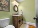 Charming bathroom with a unique rustic vanity and wood framed mirror at 315 Mountainview Dr, Charlotte, NC 28270