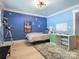 bedroom features colorful decor, a desk, and playful space-themed decorations at 315 Mountainview Dr, Charlotte, NC 28270
