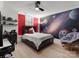 Bedroom with desk, planets wall art, chair, and bed with drawers, offering a cozy retreat at 315 Mountainview Dr, Charlotte, NC 28270
