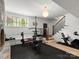 Basement gym area featuring various workout equipment and a stone accent wall at 315 Mountainview Dr, Charlotte, NC 28270