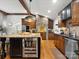 Kitchen featuring wooden cabinets, granite countertops, stainless steel appliances and a beverage refrigerator at 315 Mountainview Dr, Charlotte, NC 28270