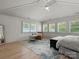 Bright and airy main bedroom with large windows, neutral decor, and a comfortable seating area at 315 Mountainview Dr, Charlotte, NC 28270