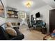 Bright home office featuring custom shelves, light wood floors, and ample workspace at 315 Mountainview Dr, Charlotte, NC 28270