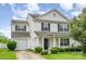 Charming two-story home with a well-maintained front yard and a one-car garage at 3244 Oulten Sw St, Concord, NC 28027