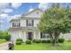 Traditional two-story house with a covered front porch and neatly landscaped yard at 3244 Oulten Sw St, Concord, NC 28027