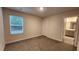 Bedroom with neutral walls, plush carpet, and an en suite bathroom at 332 Cranford Dr, Pineville, NC 28134