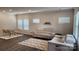 Bright living room with two sofas, modern rug, and dining area at 332 Cranford Dr, Pineville, NC 28134
