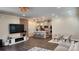 Open-concept living room and kitchen with modern decor, island seating, and stylish light fixtures at 332 Cranford Dr, Pineville, NC 28134
