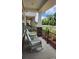 Inviting porch with rocking chairs, offering a relaxing outdoor space with views of the landscaped surroundings at 332 Cranford Dr, Pineville, NC 28134