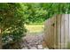Tranquil backyard with wooden fence, offers serene outdoor space at 3737 Winding Creek Ln, Charlotte, NC 28226