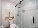 Beautiful bathroom featuring a glass shower with white tile and modern fixtures at 3737 Winding Creek Ln, Charlotte, NC 28226