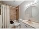Clean bathroom with a shower-tub, tile surround, and a modern vanity at 3737 Winding Creek Ln, Charlotte, NC 28226