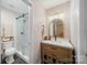 Renovated bathroom with a glass shower, updated vanity, and modern fixtures at 3737 Winding Creek Ln, Charlotte, NC 28226
