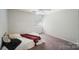Well-lit bedroom with a ceiling fan and neutral decor at 3737 Winding Creek Ln, Charlotte, NC 28226