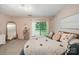 Bright bedroom with neutral carpet and balcony access at 3737 Winding Creek Ln, Charlotte, NC 28226