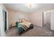 Large bedroom with plush carpet and ample natural light at 3737 Winding Creek Ln, Charlotte, NC 28226