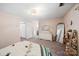 Bedroom featuring a large full-length mirror, a bright chandelier and carpeted floors at 3737 Winding Creek Ln, Charlotte, NC 28226