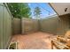 Private courtyard with red brick and string lights for enjoying a quiet outdoor setting at 3737 Winding Creek Ln, Charlotte, NC 28226