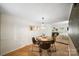 Bright dining room featuring modern lighting, neutral decor, and comfortable seating at 3737 Winding Creek Ln, Charlotte, NC 28226