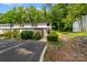 Two-story townhome with landscaped front and reserved parking space at 3737 Winding Creek Ln, Charlotte, NC 28226