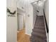 Hallway with a staircase, light wood-look floors and a coat closet at 3737 Winding Creek Ln, Charlotte, NC 28226