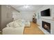 Spacious living room featuring a fireplace, hardwood floors, and neutral color palette at 3737 Winding Creek Ln, Charlotte, NC 28226