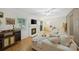 Comfortable living room featuring a fireplace, hardwood floors, and plenty of seating at 3737 Winding Creek Ln, Charlotte, NC 28226