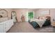 Bright main bedroom with a sliding glass doors that provide outdoor access at 3737 Winding Creek Ln, Charlotte, NC 28226