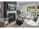 Bright living room featuring a fireplace, sliding glass doors to patio, and neutral decor, perfect for relaxing or entertaining guests at 4146 Eastover Glen Rd # 0322, Charlotte, NC 28269