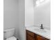 Bathroom showcasing a vanity with dark wood and a toilet at 4208 Coulter Xing, Charlotte, NC 28213