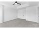 Bedroom featuring new carpet, neutral walls, and a ceiling fan at 4208 Coulter Xing, Charlotte, NC 28213