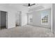 Spacious bedroom with fresh, neutral walls, large windows, and tray ceiling at 4208 Coulter Xing, Charlotte, NC 28213