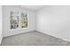 Bright bedroom with two windows and neutral carpet at 4208 Coulter Xing, Charlotte, NC 28213