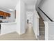 Bright entryway featuring sleek floors, staircase, and ample natural light at 4208 Coulter Xing, Charlotte, NC 28213